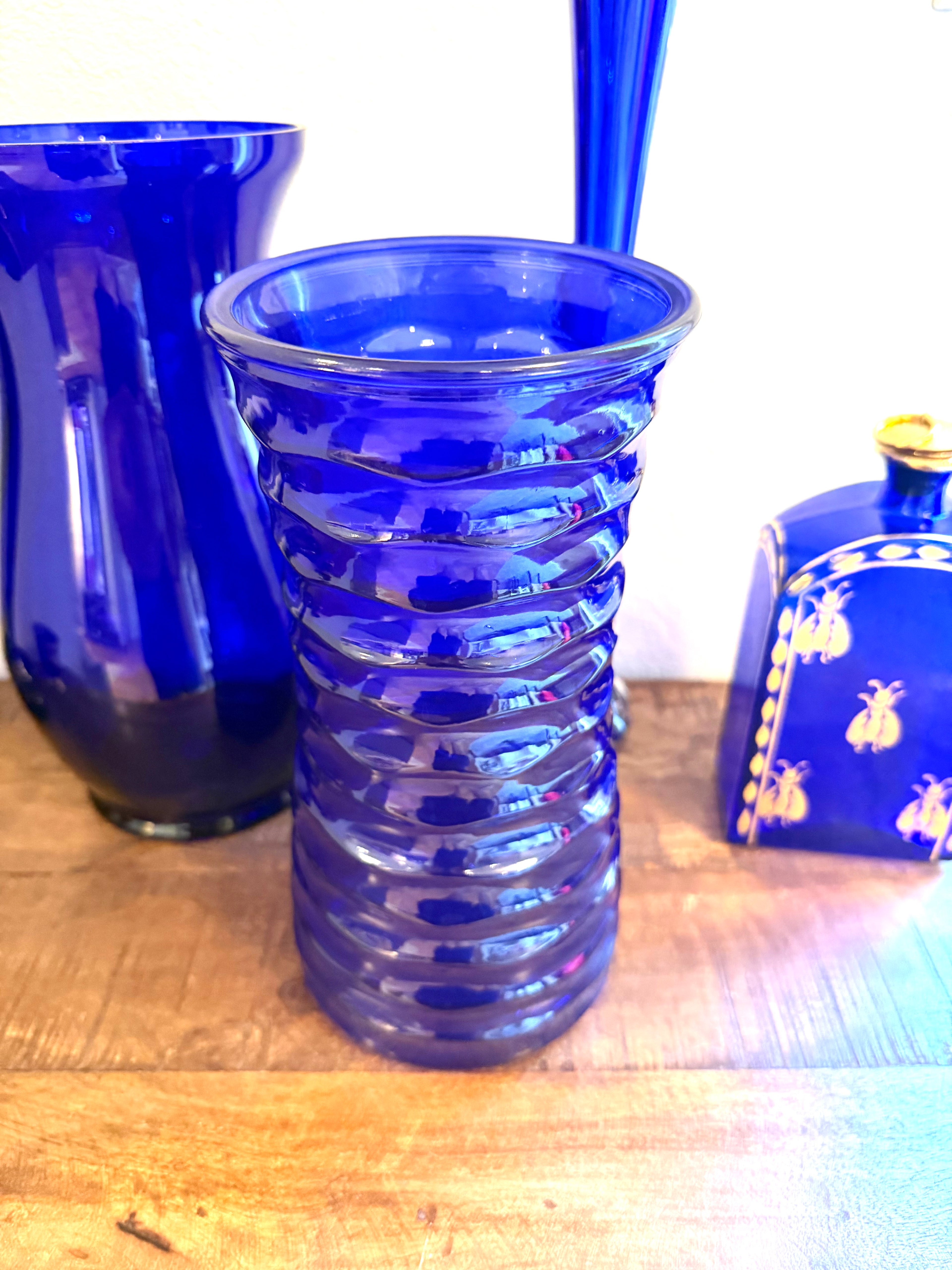 Cobalt blue art glass vase featuring a sculptural ribbed design and rich sapphire color. An elegant Mid-Century decorative accent for refined interiors.