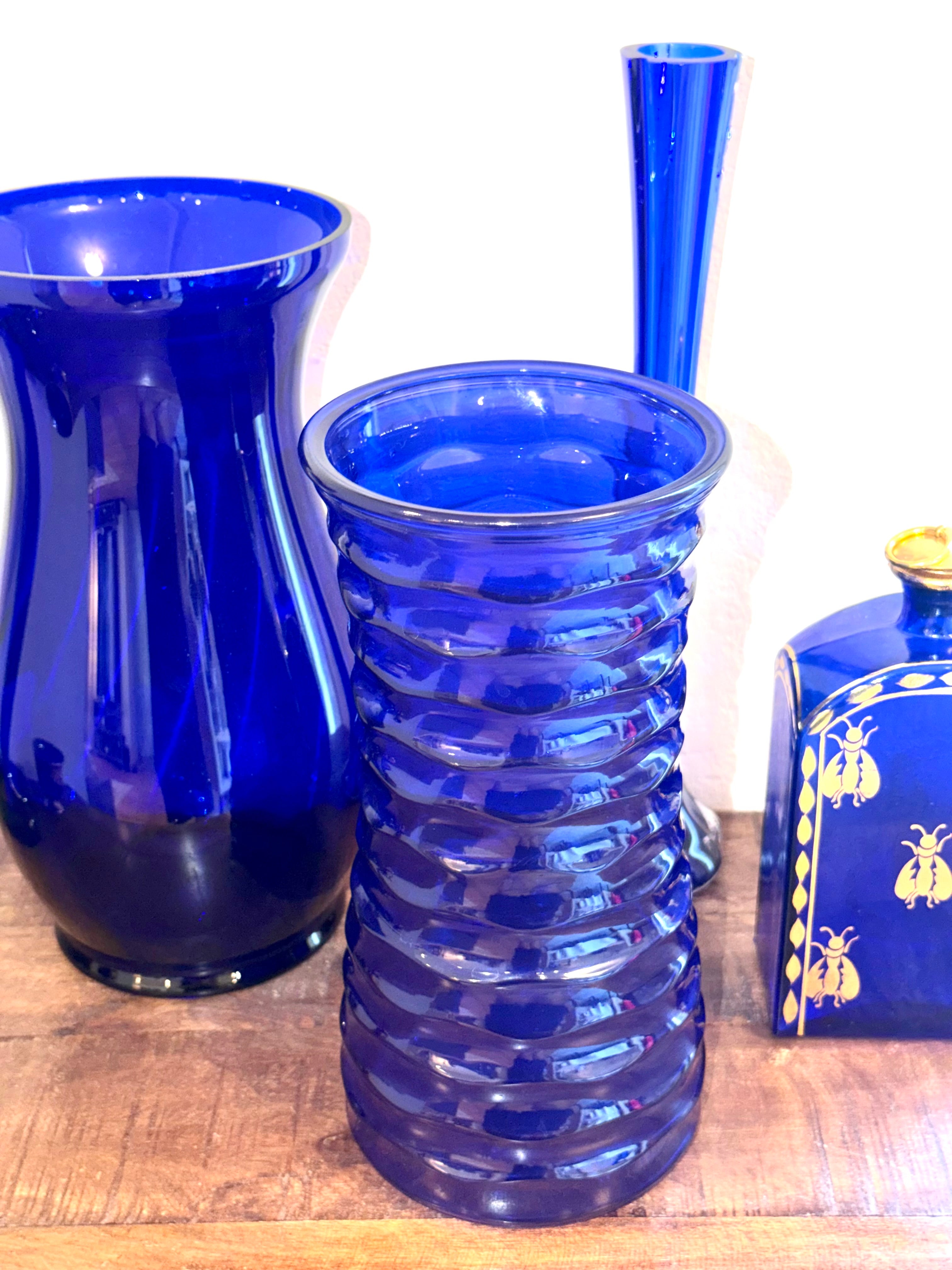 Cobalt blue art glass vase featuring a sculptural ribbed design and rich sapphire color. An elegant Mid-Century decorative accent for refined interiors.