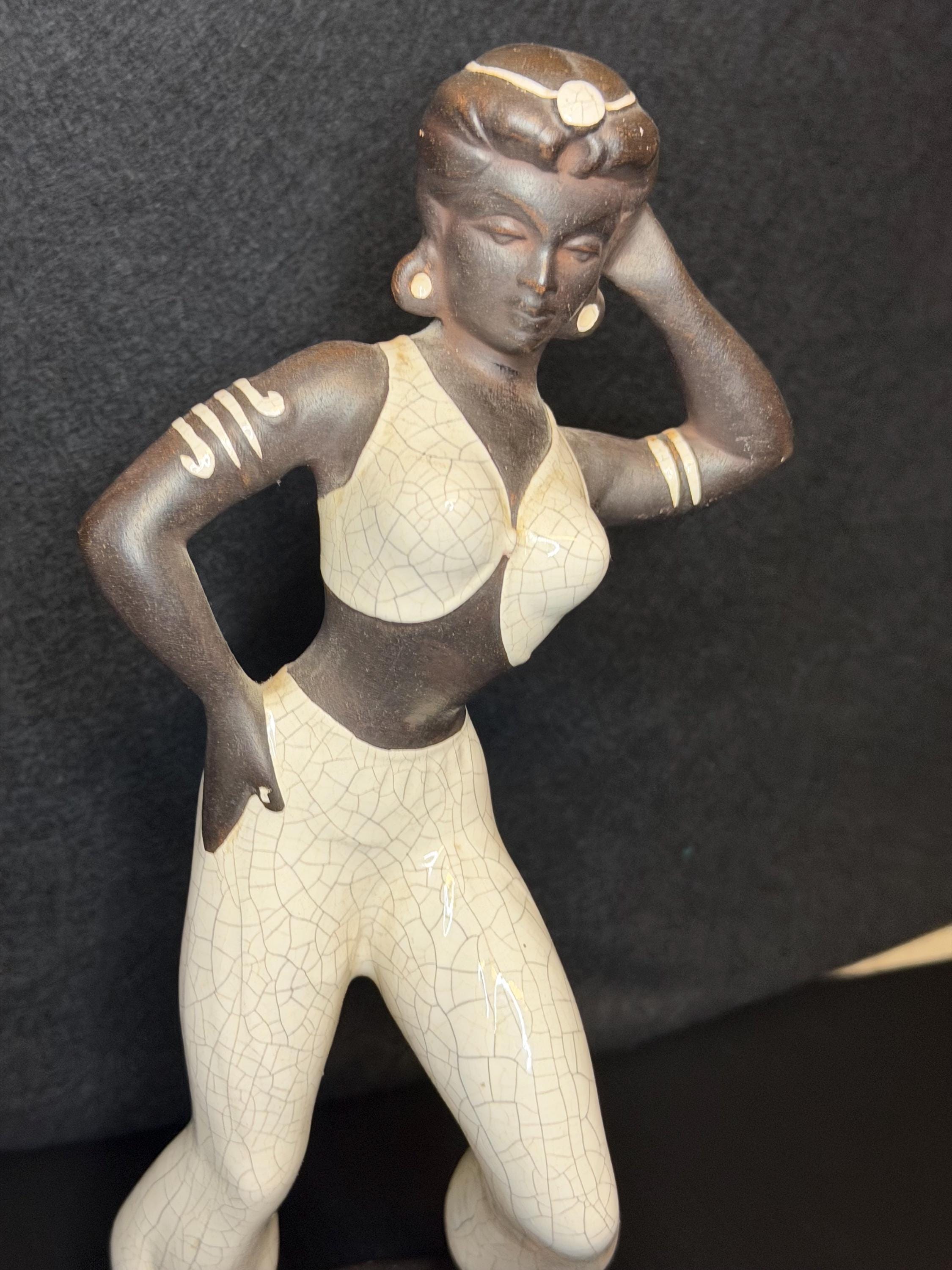 A beautifully sculpted mid-century ceramic figure capturing grace, strength, and quiet poise.