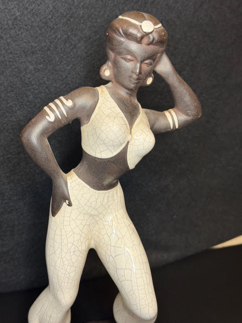 A beautifully sculpted mid-century ceramic figure capturing grace, strength, and quiet poise.