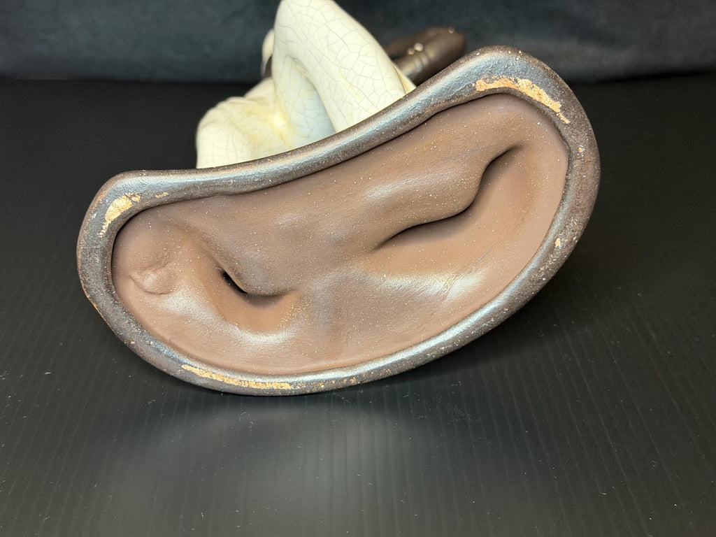 A beautifully sculpted mid-century ceramic figure capturing grace, strength, and quiet poise.