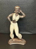 A beautifully sculpted mid-century ceramic figure capturing grace, strength, and quiet poise.