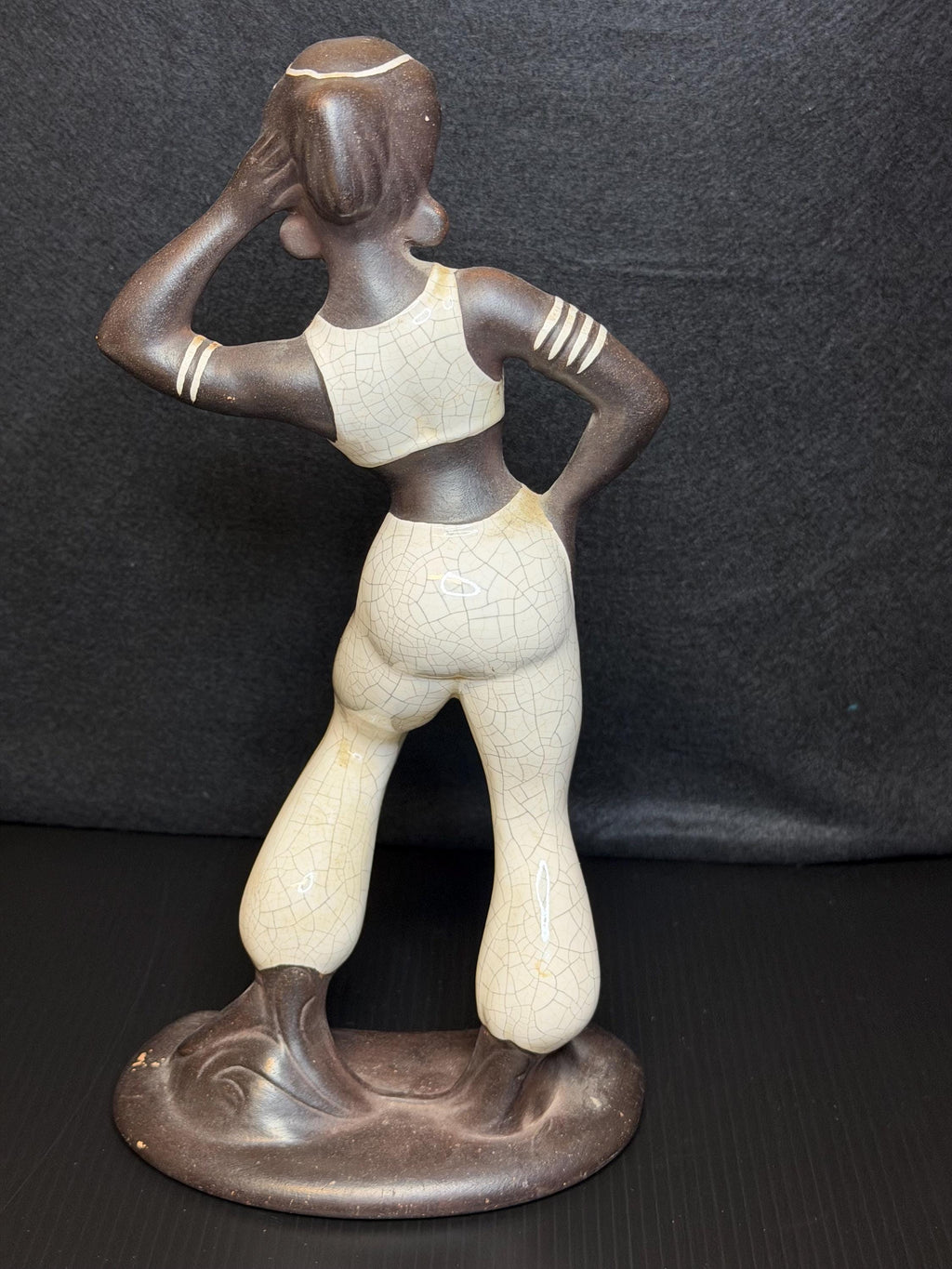 A beautifully sculpted mid-century ceramic figure capturing grace, strength, and quiet poise.
