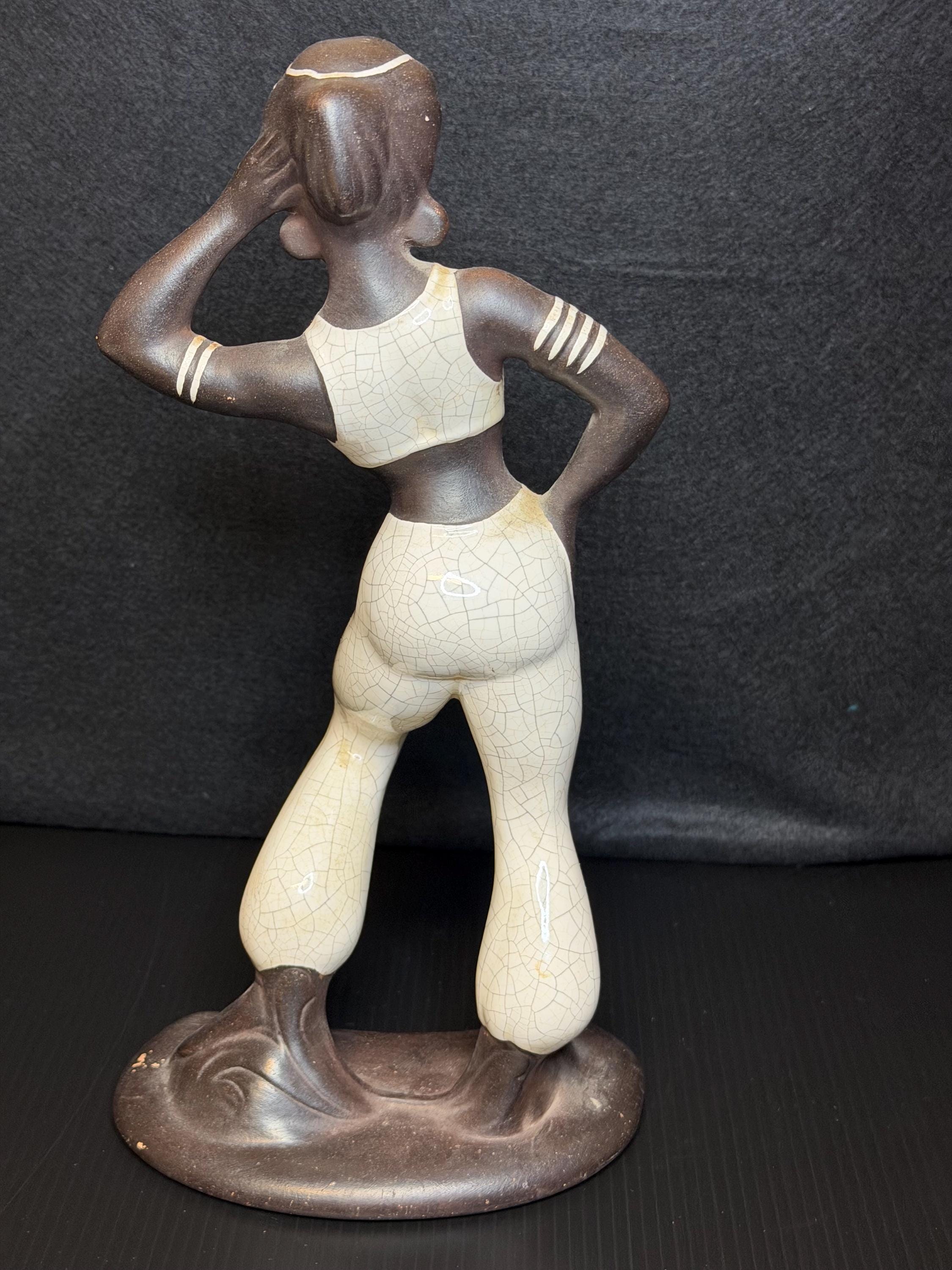 A beautifully sculpted mid-century ceramic figure capturing grace, strength, and quiet poise.
